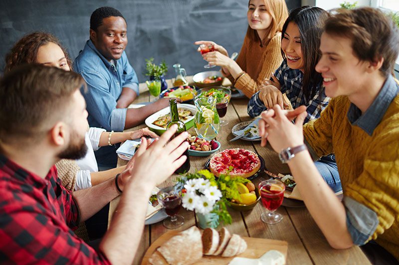 Tips for staying sober during the holidays - group of friends for holiday gathering