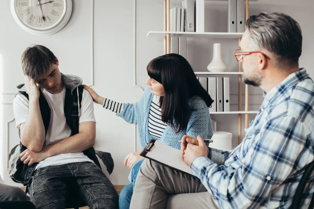 Addiction and Mental Health mom coping depressed son at therapy